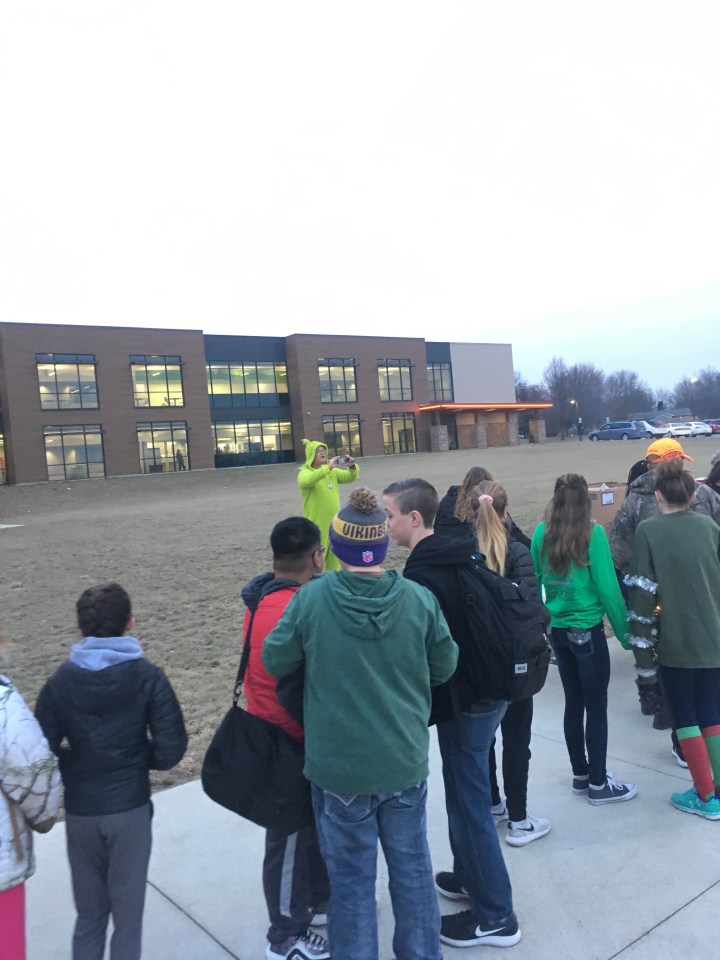 Yes, that's CCMS Principal Rick Gabel taking a photo while dressed as the Grinch.
